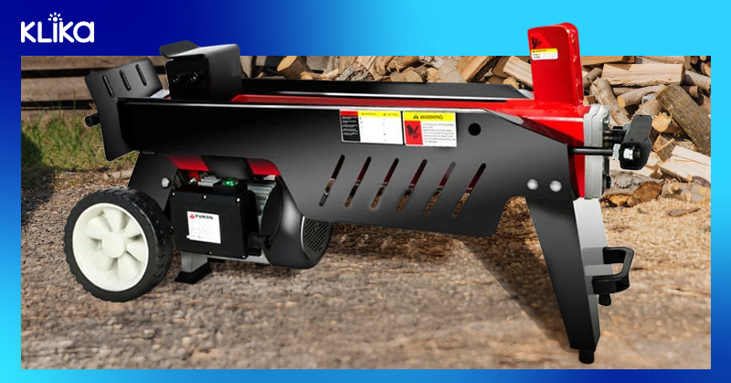 One of our log splitters alongside a pile of logs
