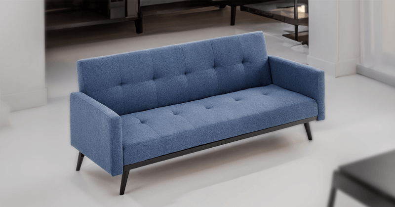 Blue sofa bed in a living room Blue sofa bed in a living room