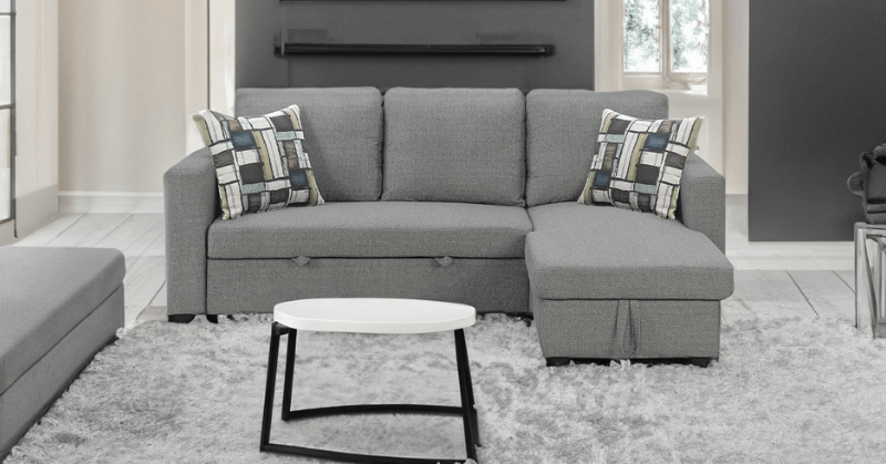 Stylish grey sectional sofa bed in living room Stylish grey sectional sofa bed in living room